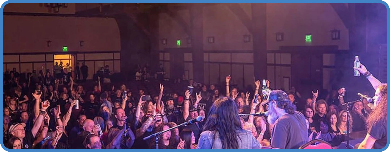 A lively crowd enjoying a concert | The Mountain Music Festival