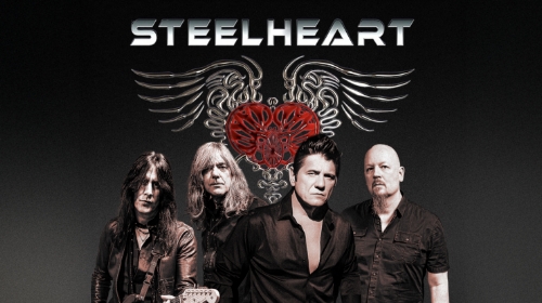 Steelheart promotional photo: four band members in black attire posing under a dramatic wings-and-heart logo.